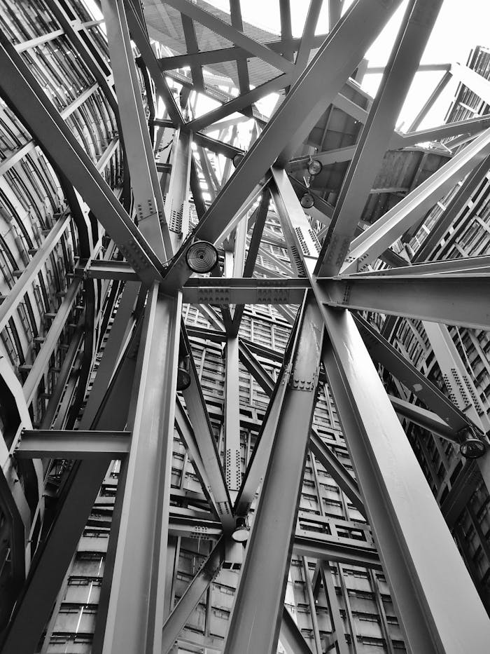 services-02 A detailed view of a complex steel framework showcasing modern industrial architecture.